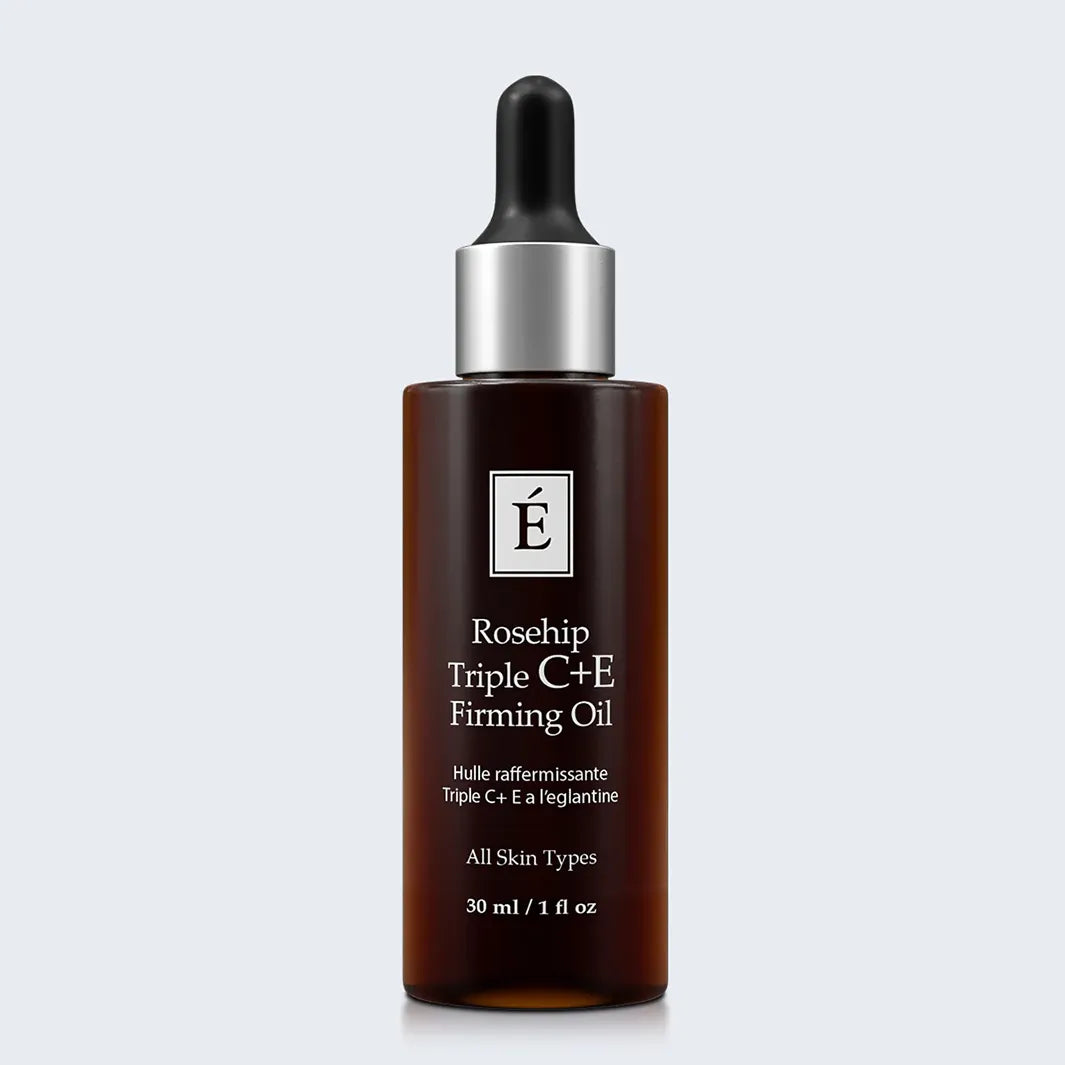 Eminence Organics Rosehip Triple C+E Firming Oil on light blue background
