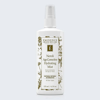 Eminence Organics Neroli Age Corrective Hydrating Mist on light blue background