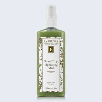 Eminence Organics Stone Crop Hydrating Mist on light blue background